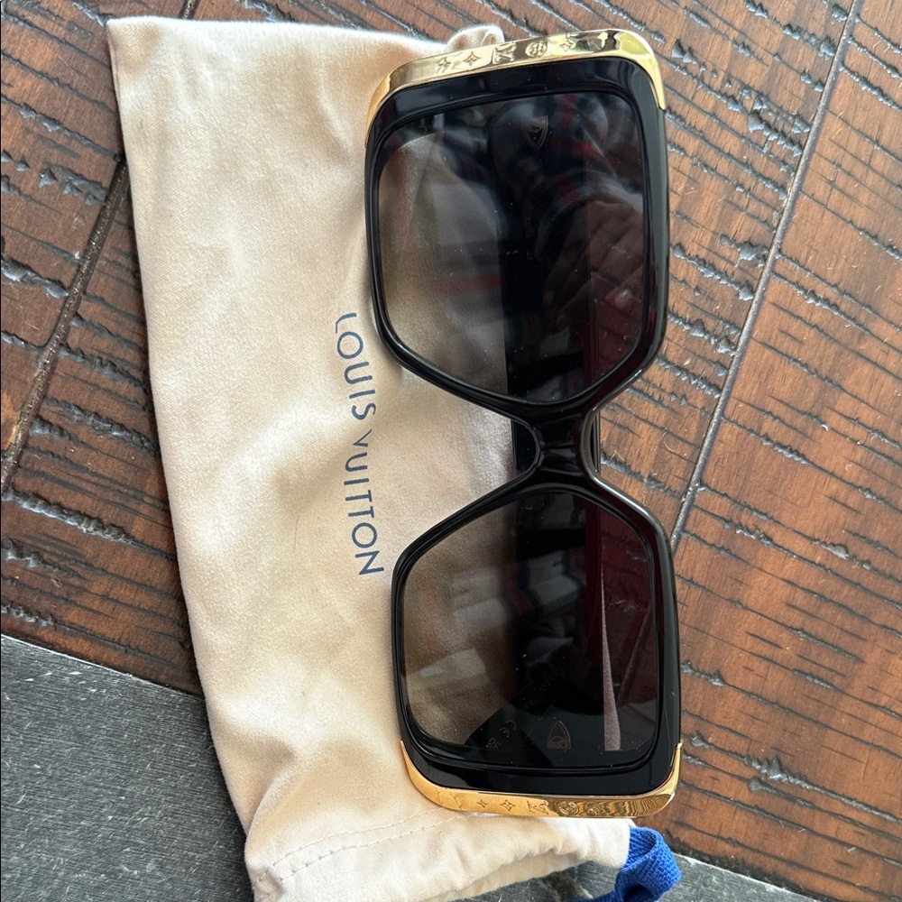 Louis Vuitton Elegant Black and Gold moon Sunglasses.